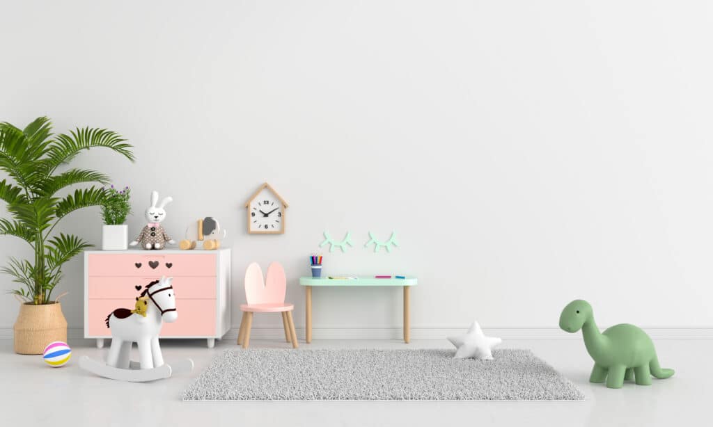 Déco Chambre Enfant Pastel : Style Scandinave et Doux Chambre d'enfant scandinave pastel avec commode rose, bureau menthe, peluche dinosaure et cheval à bascule blanc.
